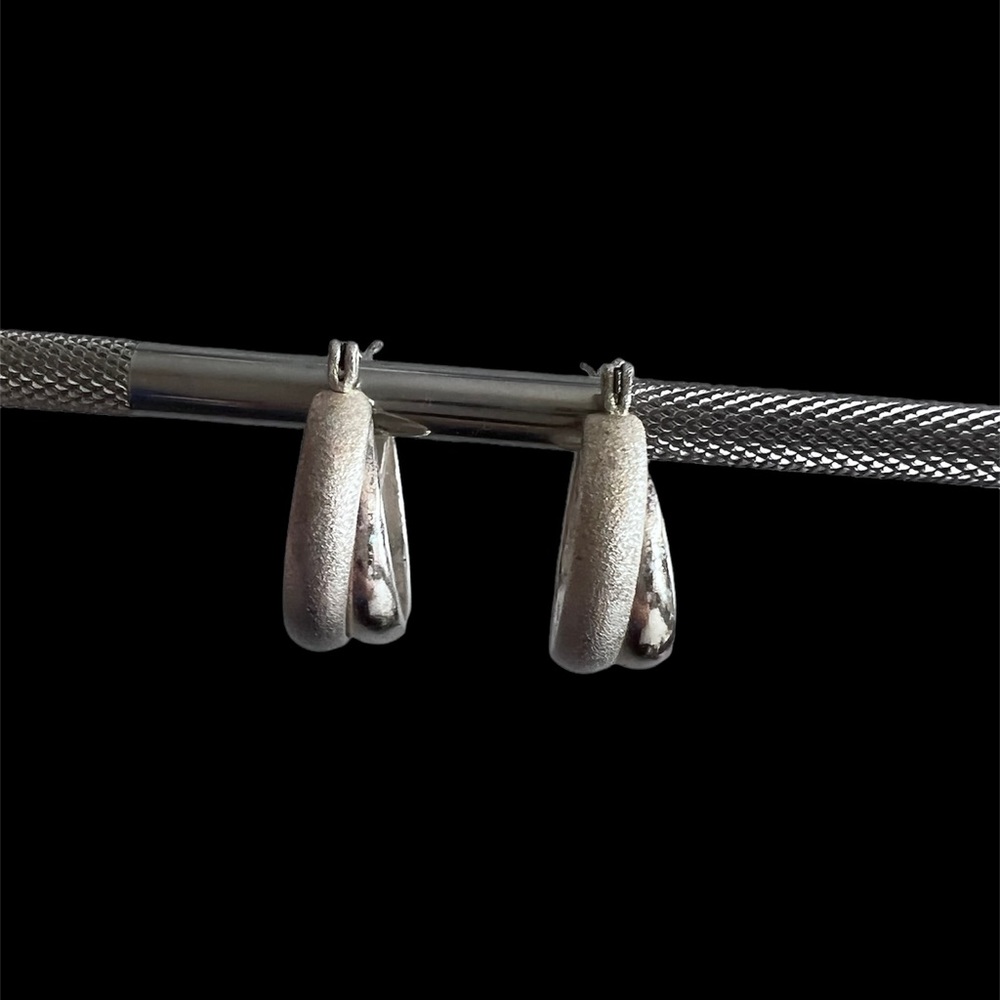 Pierced silver hoop earrings